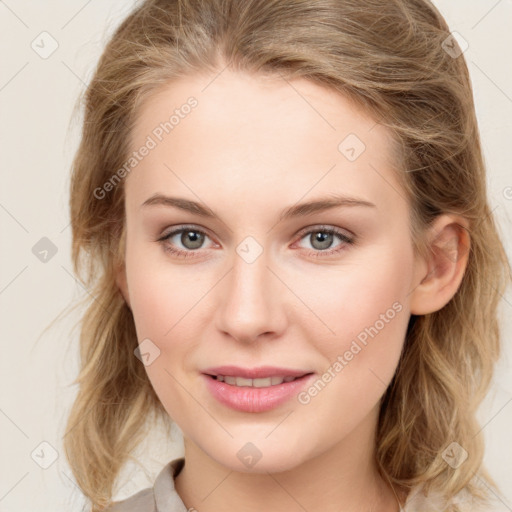 Joyful white young-adult female with long  brown hair and blue eyes