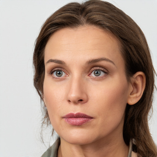 Neutral white young-adult female with medium  brown hair and grey eyes