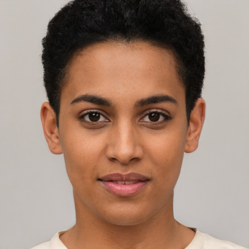 Joyful latino young-adult female with short  brown hair and brown eyes