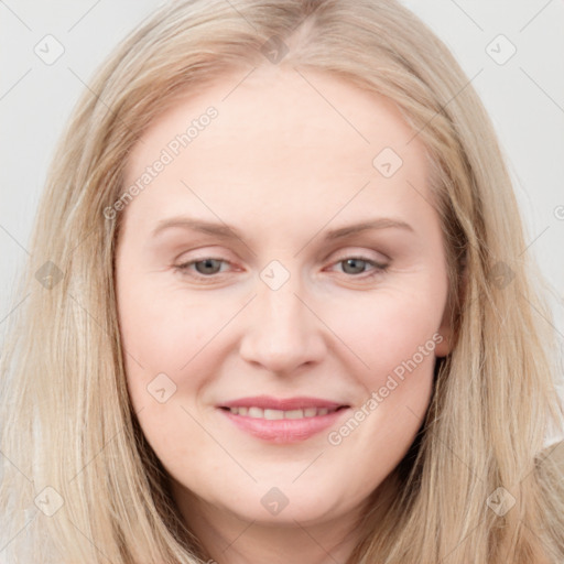 Joyful white young-adult female with long  brown hair and blue eyes