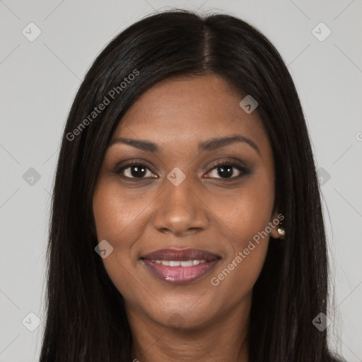 Joyful black young-adult female with long  brown hair and brown eyes