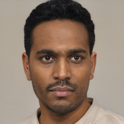 Neutral latino young-adult male with short  black hair and brown eyes
