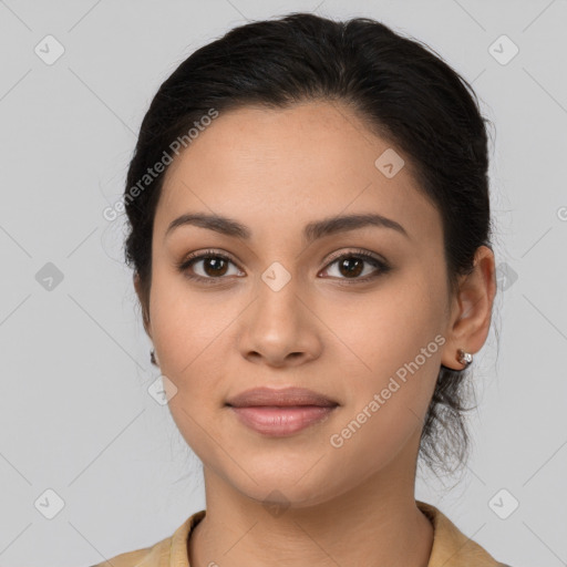 Joyful latino young-adult female with medium  brown hair and brown eyes