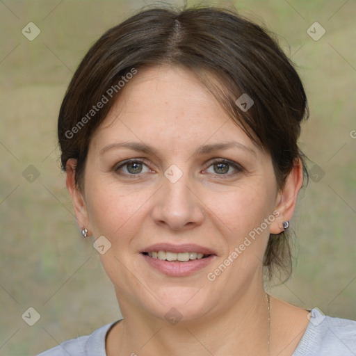 Joyful white adult female with medium  brown hair and grey eyes