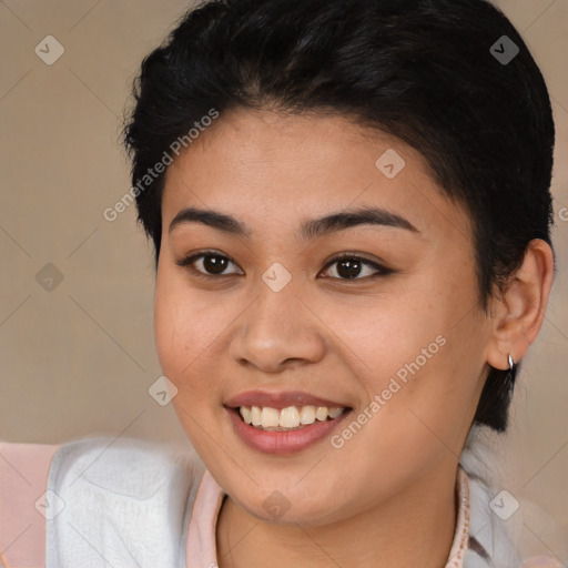 Joyful latino young-adult female with long  brown hair and brown eyes