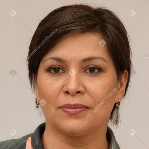 Joyful white adult female with medium  brown hair and brown eyes