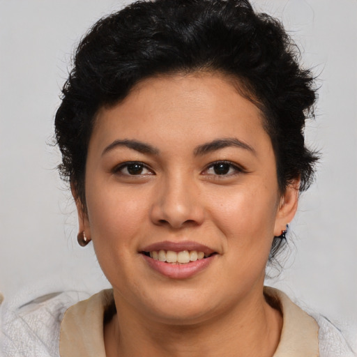 Joyful latino young-adult female with short  brown hair and brown eyes