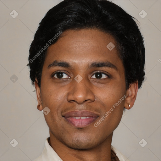 Joyful black young-adult male with short  black hair and brown eyes