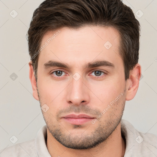 Neutral white young-adult male with short  brown hair and brown eyes