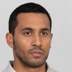 Neutral latino young-adult male with short  black hair and brown eyes