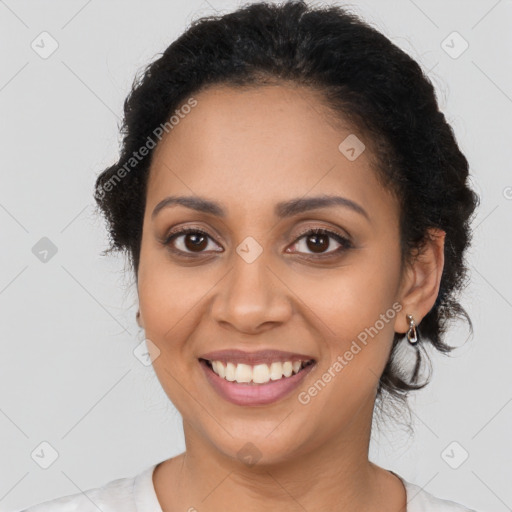 Joyful latino young-adult female with long  brown hair and brown eyes