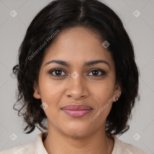 Joyful black young-adult female with medium  brown hair and brown eyes