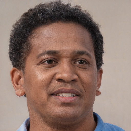 Neutral latino adult male with short  brown hair and brown eyes