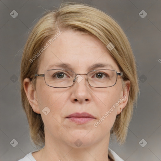 Joyful white adult female with medium  brown hair and blue eyes