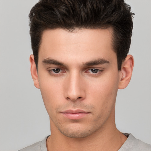 Neutral white young-adult male with short  brown hair and brown eyes