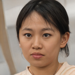 Neutral asian young-adult female with medium  brown hair and brown eyes