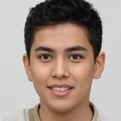 Joyful asian young-adult male with short  brown hair and brown eyes