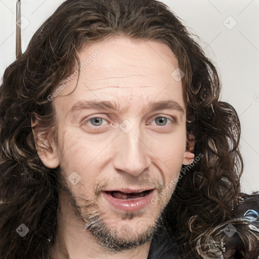 Joyful white adult male with medium  brown hair and brown eyes