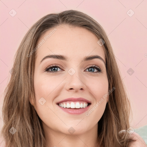 Joyful white young-adult female with long  brown hair and green eyes