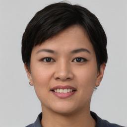 Joyful asian young-adult female with short  black hair and brown eyes