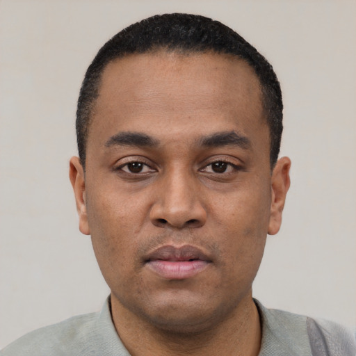 Neutral black young-adult male with short  black hair and brown eyes