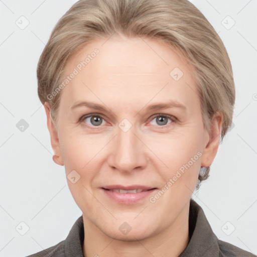 Joyful white adult female with short  brown hair and grey eyes