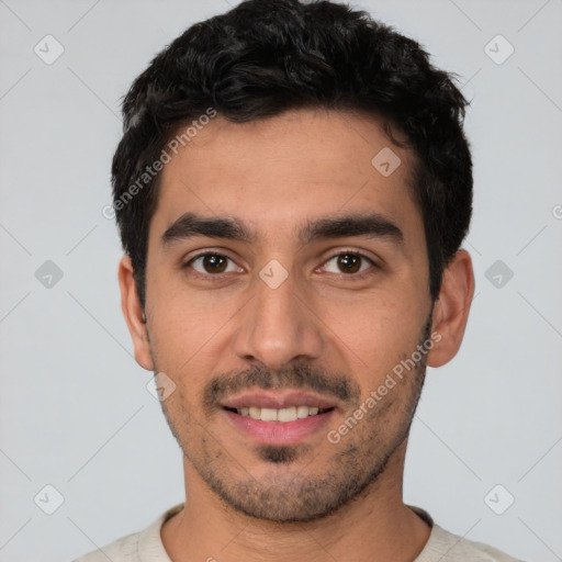 Joyful white young-adult male with short  black hair and brown eyes