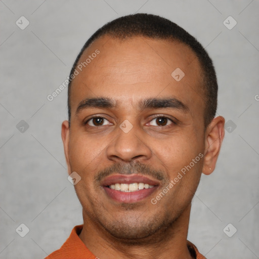 Joyful latino young-adult male with short  brown hair and brown eyes