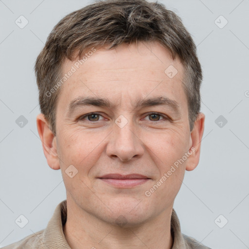 Joyful white adult male with short  brown hair and grey eyes