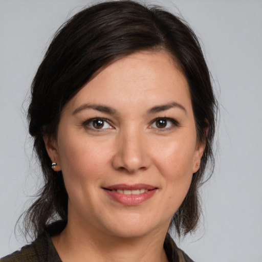 Joyful white young-adult female with medium  brown hair and brown eyes