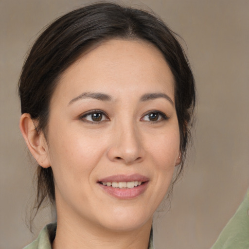 Joyful white young-adult female with medium  brown hair and brown eyes