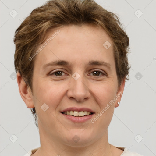 Joyful white adult female with short  brown hair and grey eyes