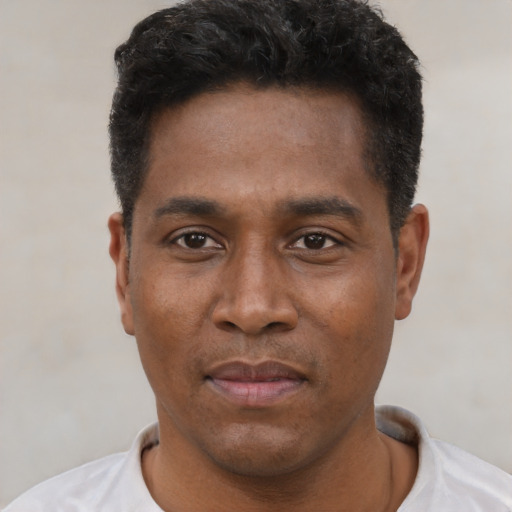 Neutral black young-adult male with short  black hair and brown eyes