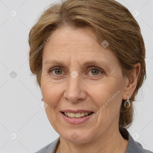 Joyful white adult female with medium  brown hair and grey eyes