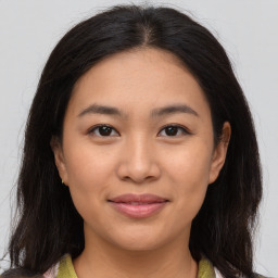 Joyful asian young-adult female with medium  brown hair and brown eyes