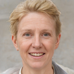 Joyful white adult female with short  brown hair and grey eyes