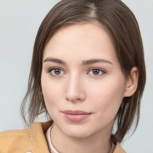 Neutral white young-adult female with medium  brown hair and brown eyes