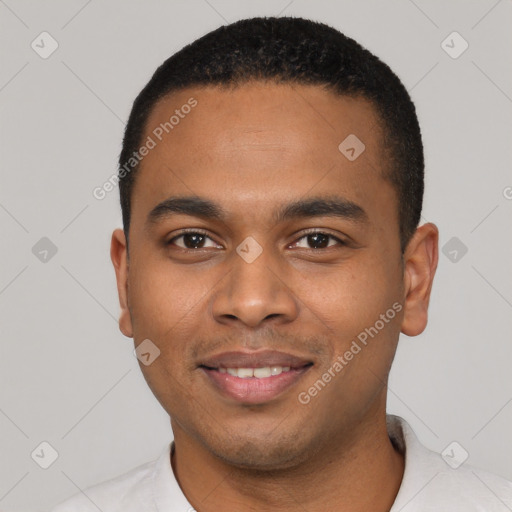 Joyful black young-adult male with short  black hair and brown eyes