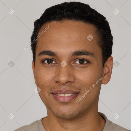 Joyful black young-adult male with short  black hair and brown eyes