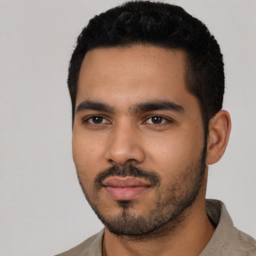 Neutral latino young-adult male with short  black hair and brown eyes