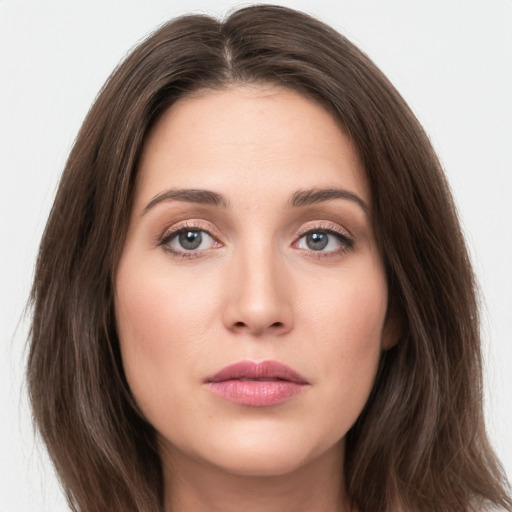 Neutral white young-adult female with medium  brown hair and brown eyes