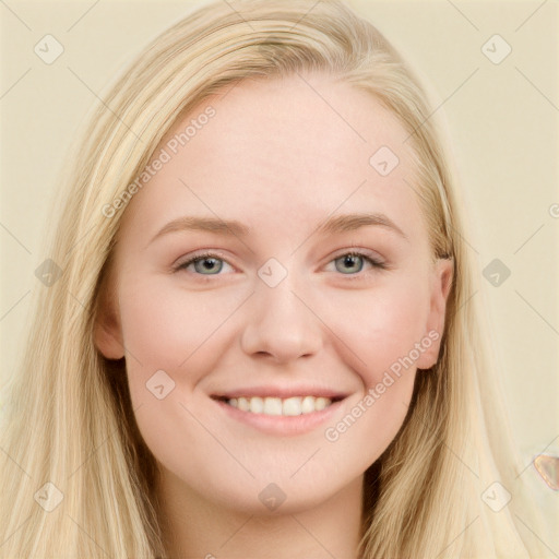 Joyful white young-adult female with long  brown hair and blue eyes