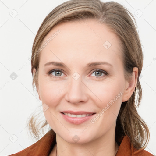 Joyful white young-adult female with medium  brown hair and blue eyes