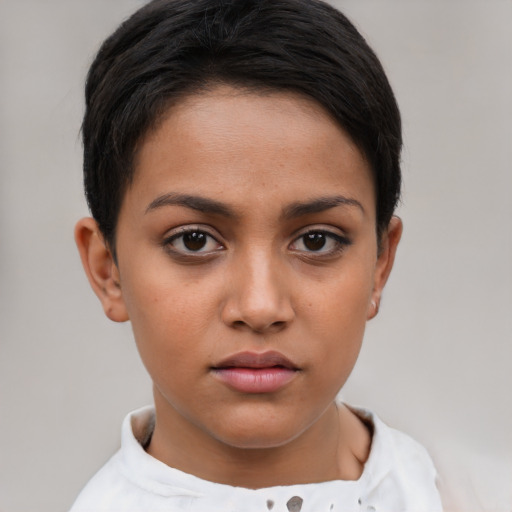 Joyful latino young-adult female with short  brown hair and brown eyes