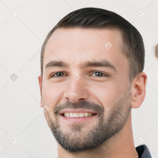 Joyful white young-adult male with short  brown hair and brown eyes