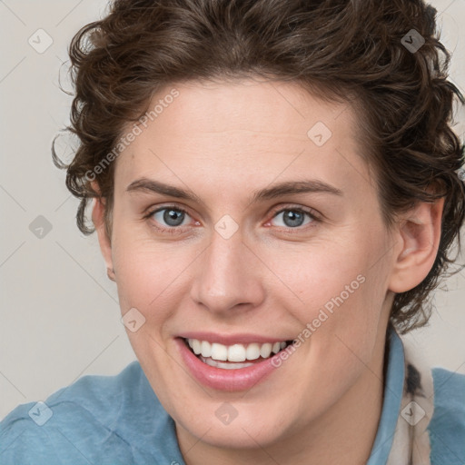 Joyful white young-adult female with medium  brown hair and blue eyes