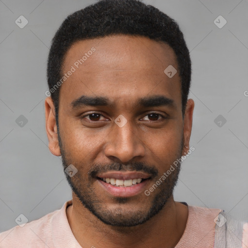 Joyful black young-adult male with short  black hair and brown eyes