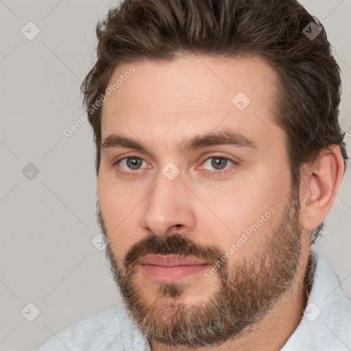 Neutral white young-adult male with short  brown hair and brown eyes