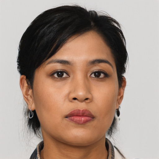 Neutral asian young-adult female with medium  black hair and brown eyes