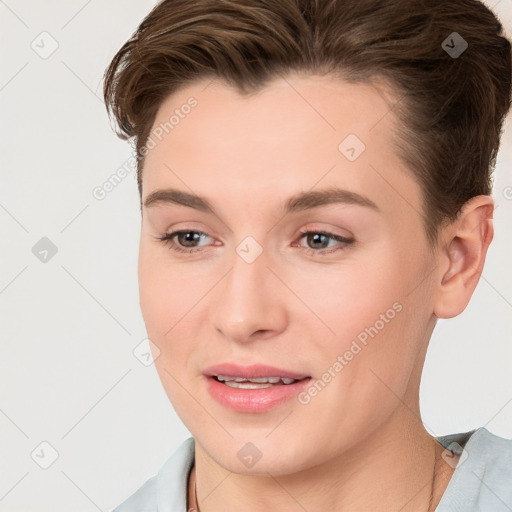 Joyful white young-adult female with short  brown hair and brown eyes